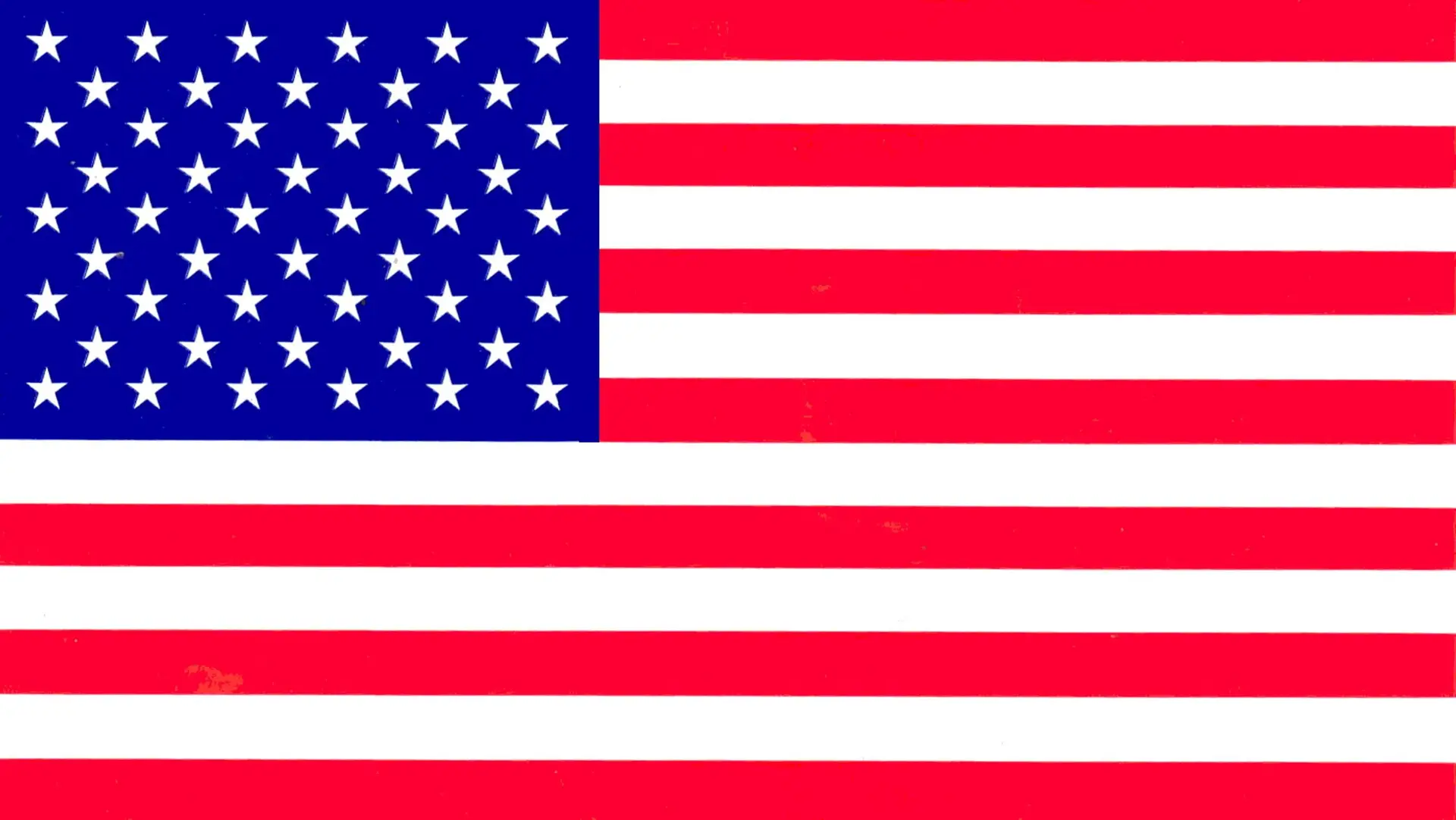 United States flag with 50 white stars on a blue field and 13 red and white stripes